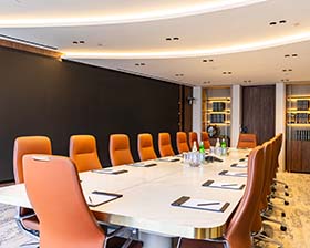 A large board room with clean lighting a leading lines